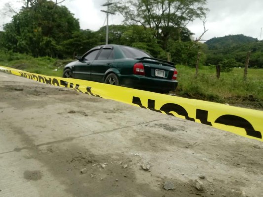 Hallan cadáver de joven atado de manos en el baúl de un auto en Choloma