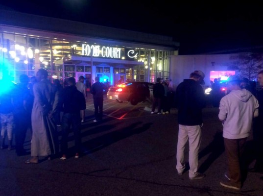 This image from video provided by KSTP 5 television in Minneapolis, Minnesota, shows people standing outside the scene of a stabbing at the Crossroads Center mall in St. Cloud, Minnesota.A man making 'some references to Allah' stabbed and injured eight people September 17, 2016 in a shopping mall in the US state of Minnesota, before being shot dead by an off-duty officer, police said. The suspect 'asked at least one person if they were Muslim before he assaulted them,' Blair Anderson, the police chief in the city of St. Cloud where the attack took place, told journalists. Anderson said the armed suspect entered the Crossroads Center mall in St. Cloud -- a city of about 67,000 people some 70 miles (110 km) northwest of Minneapolis -- and attacked at least eight people. / AFP PHOTO / KSTP TV / HO / RESTRICTED TO EDITORIAL USE - MANDATORY CREDIT 'AFP PHOTO /KSTP 5 TELEVISION' - NO MARKETING NO ADVERTISING CAMPAIGNS - DISTRIBUTED AS A SERVICE TO CLIENTS == NO ARCHIVE ==NO SALES== MINNEAPOLIS-ST.PAUL NEWS SOURCES OUT ==