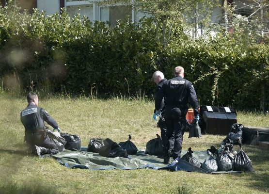 French police demining team identify the weapons handed by Basque separatist group ETA (Basque acronym for Euskadi Ta Askatasuna) in Saint-Pee-sur-Nivelle on April 8, 2017.France said a move by the Basque separatist group ETA to hand over weapons on Saturday was a 'major step' and 'an undeniably important day.' 'This stage of neutralising an arsenal of arms and explosives is a major step,' Interior Minister Matthias Fekl said. ETA earlier handed the French authorities a list of arms caches, an operation that it has said will complete its disarmament. / AFP PHOTO / IROZ GAIZKA