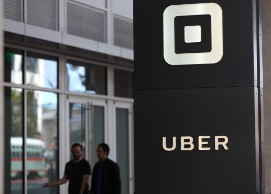 (FILES) This file photo taken on August 25, 2016 shows the logo of the ride sharing service Uber in front of its headquarters in San Francisco, California. Uber has parted ways with another top executive, in the latest dent to the reputation of the ridesharing giant as it prepares to release the results of a probe into workplace misconduct. The executive, Eric Alexander, read and discussed medical information about a woman raped in India in 2014 during an Uber ride, according to reports in the New York Times and Recode.An Uber spokeswoman told AFP on June 8, 2017 that Alexander is 'no longer with the company,' but declined to comment on the reasons for his departure or on the reports on his handling of the India rape case. / AFP PHOTO / GETTY IMAGES NORTH AMERICA / JUSTIN SULLIVAN