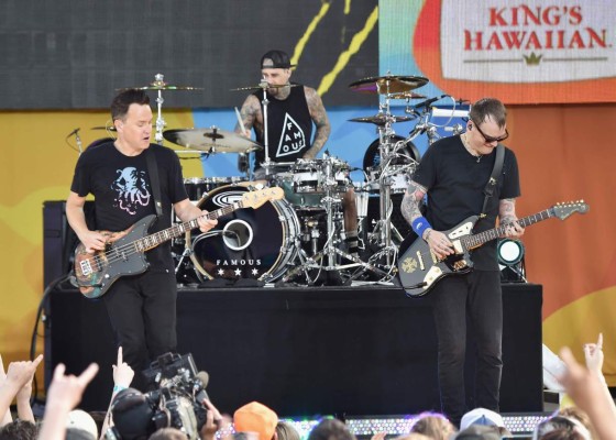 (FILES) This file photo taken on July 1, 2016 shows (L-R) Mark Hoppus, Travis Barker, and Matt Skiba of the band Blink 182 performing on ABC's 'Good Morning America' at SummerStage at Rumsey Playfield, Central Park in New York City. Rockers Blink-182 on Saturday called off stadium shows they had planned with Linkin Park whose singer Chester Bennington hanged himself.To go with story 'Blink-182 calls off shows after Linkin Park suicide' by Shaun Tandon. / AFP PHOTO / GETTY IMAGES NORTH AMERICA / Mike Coppola