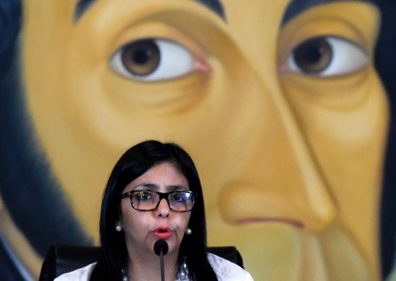 Venezuelan Foreign Minister Delcy Rodriguez speaks during a press conference in Caracas on March 29, 2017.Rodriguez accused on Wednesday the government of the United States of putting pressure on other OAS members to execute an 'interventionist plan' in her country. / AFP PHOTO / JUAN BARRETO