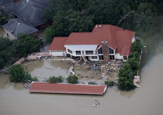 HOUSTON, TX - AUGUST 30: Flooded homes are shown near Lake Houston following Hurricane Harvey August 29, 2017 in Houston, Texas. The city of Houston is still experiencing severe flooding in some areas due to the accumulation of historic levels of rainfall, though the storm has moved to the north and east. Win McNamee/Getty Images/AFP== FOR NEWSPAPERS, INTERNET, TELCOS & TELEVISION USE ONLY ==