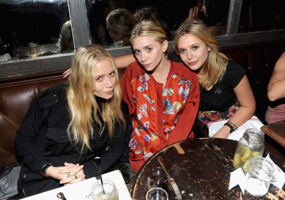 NEW YORK, NY - OCTOBER 05: (EXCLUSIVE COVERAGE) Mary- Kate Olsen,Ashley Olsen and Elizabeth Olsen attend the NYLON & AX Armani Exchange Private Dinner for the October issue with cover star Lizzie Olsen on October 5, 2011 in New York City. (Photo by Jamie McCarthy/WireImage for Nylon Magazine)