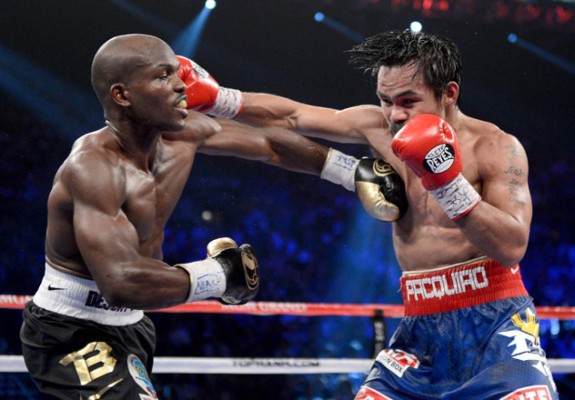 LAS VEGAS, NV - JUNE 09: (L-R) Timothy Bradley and Manny Pacquiao exchange punches during their WBO welterweight title fight at MGM Grand Garden Arena on June 9, 2012 in Las Vegas, Nevada. (Photo by Kevork Djansezian/Getty Images)