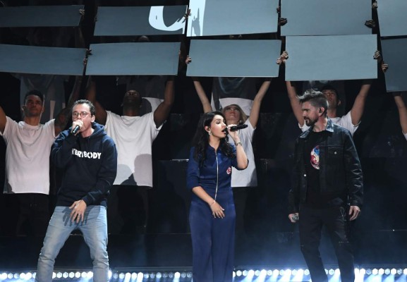 LAS VEGAS, NV - NOVEMBER 16: (L-R) Logic, Alessia Cara and Juanes perform onstage at the 18th Annual Latin Grammy Awards at MGM Grand Garden Arena on November 16, 2017 in Las Vegas, Nevada. Kevin Winter/Getty Images/AFP