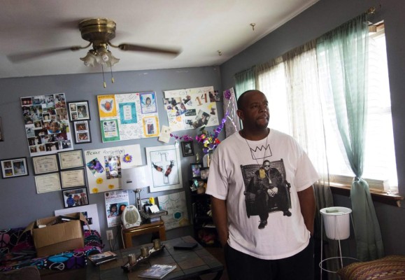 Robert Mickens, father of Nisa Mickens, pauses while he answers questions at his home June 7, 2017 in Brentwood, New York.The town of Brentwood on New York's Long Island may look like an oasis of calm away from the hustle and bustle of Manhattan. But behind its timber homes and neat front yards, terror lurks. In this middle-class town 44 miles (70 kilometers) from New York and about the same distance from the glitzy Hamptons summer retreat for Manhattan's millionaires, the Latino street gang MS-13 exerts a brutal grip. / AFP PHOTO / Don Emmert