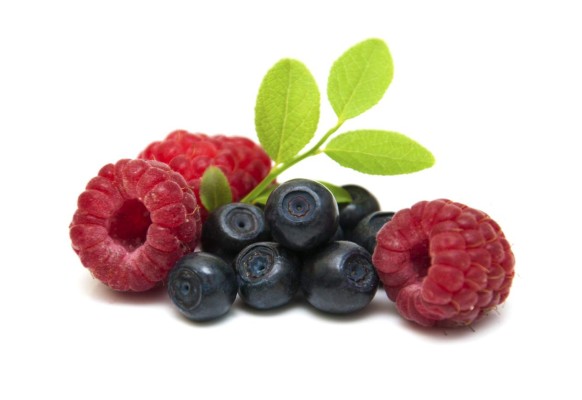 Assorted fresh berries on a white background