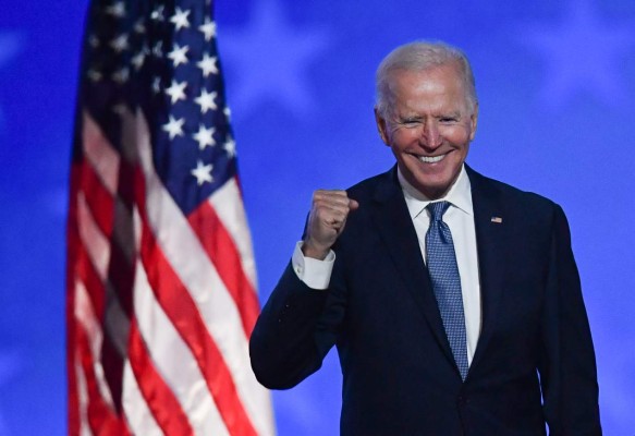 Democratic presidential nominee Joe Biden gestures after speaking during election night at the Chase Center in Wilmington, Delaware, early on November 4, 2020. - Democrat Joe Biden said early Wednesday he believes he is 'on track' to defeating US President Donald Trump, and called for Americans to have patience with vote-counting as several swing states remain up in the air.'We believe we are on track to win this election,' Biden told supporters in nationally broadcast remarks delivered in his home city of Wilmington, Delaware, adding: 'It ain't over until every vote is counted.' (Photo by ANGELA WEISS / AFP)