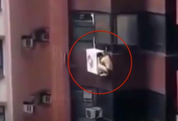 Escapa por ventana de edificio para huir del esposo de su amante