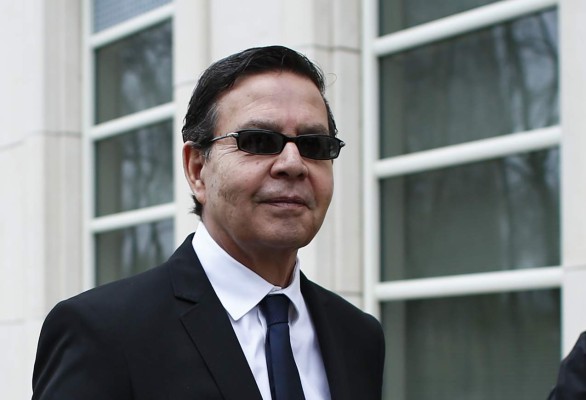 (FILES) In this file picture taken on March 28, 2016 former Honduran President (1990-1994) Rafael Callejas leaves the Brooklyn federal court in New York, after pleading guilty to charges of racketeering conspiracy and wire fraud conspiracy in connection with the FIFA corruption scandal. - Callejas, who pleaded guilty in New York in 2016 to conspiracy to commit racketeering and wire fraud in connection with the FIFA corruption scandal, died of a cardiac arrest at age 76 on April 4, 2020 at a hospital in Atlanta, while awaiting sentencing in the United States. (Photo by KENA BETANCUR / AFP)