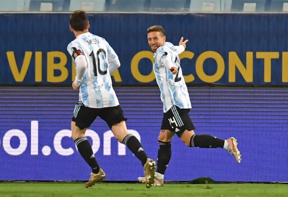Argentina's Alejandro Gomez (R) celebrates with teammate Lionel Messi for his assist, after scoring against Bolivia during the Conmebol Copa America 2021 football tournament group phase match, at the Arena Pantanal Stadium in Cuiaba, Brazil, on June 28, 2021. (Photo by DOUGLAS MAGNO / AFP)