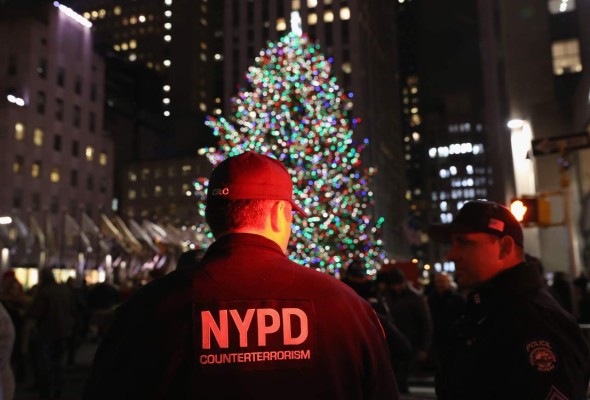NEW YORK, NY - DECEMBER 12: Counterterrorism police stand guard near the Christmas tree at Rockefeller Center on December 12, 2017 in New York City. Security in the city remained in a hightened state of alert following the previous day's bomb explosion by a Bangladeshi immigrant in New York's subway system near Times Square. John Moore/Getty Images/AFP