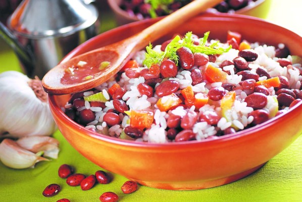 rice soup and beans in earthenware bowl
