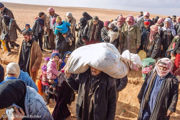 Fotos: Así huyen los niños de la guerra en Siria