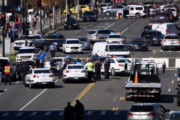 CORRECTION - Traffic and police are at the scene on March 29, 2017 in Washington,DC as a driver was arrested near the US Capitol Wednesday after they drove into a police vehicle and then tried to run over several other officers who were on foot, police said.'At some point, Capitol police apparently fired shots, but no one was struck,' the Metropolitan Police Department said in a statement. 'The individual has been taken into custody.' / AFP PHOTO / Brendan SMIALOWSKI / The erroneous mention[s] appearing in the metadata of this photo by Brendan SMIALOWSKI has been modified in AFP systems in the following manner: [driver] instead of [a man. Please immediately remove the erroneous mention[s] from all your online services and delete it (them) from your servers. If you have been authorized by AFP to distribute it (them) to third parties, please ensure that the same actions are carried out by them. Failure to promptly comply with these instructions will entail liability on your part for any continued or post notification usage. Therefore we thank you very much for all your attention and prompt action. We are sorry for the inconvenience this notification may cause and remain at your disposal for any further information you may require.