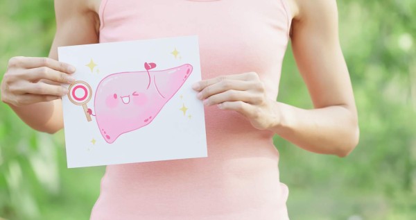 woman take liver billboard with health concept with green background