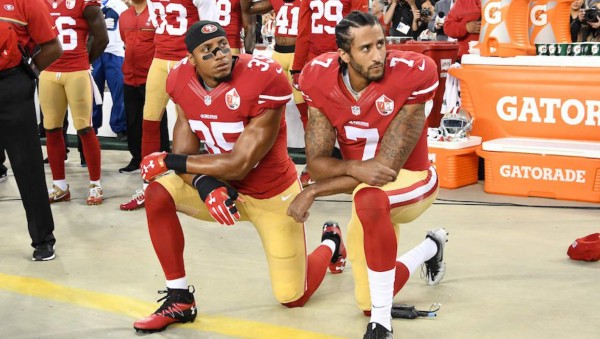 SANTA CLARA, CA - SEPTEMBER 12: Colin Kaepernick #7 and Eric Reid #35 of the San Francisco 49ers kneel in protest during the national anthem prior to playing the Los Angeles Rams in their NFL game at Levi's Stadium on September 12, 2016 in Santa Clara, California. (Photo by Thearon W. Henderson/Getty Images)