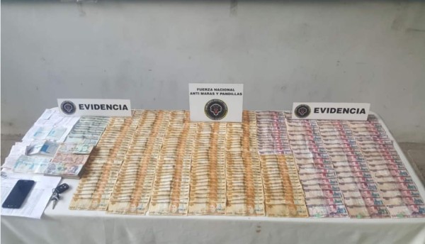 Decomisan dinero y armas a dos supuestos miembros de la Pandilla 18