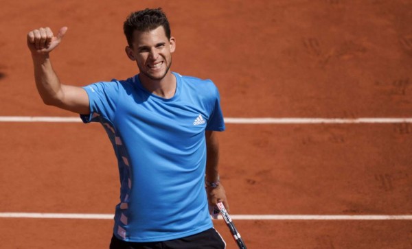 Austria's Dominic Thiem celebrates after winning against Serbia's Novak Djokovic at the end of their men's singles semi-final match on day fourteen of The Roland Garros 2019 French Open tennis tournament in Paris on June 8, 2019. (Photo by Kenzo TRIBOUILLARD / AFP)