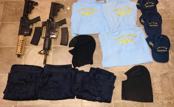 Hallan unifome policial y armas dentro del carro de comerciantes ultimados en Puerto Cortés