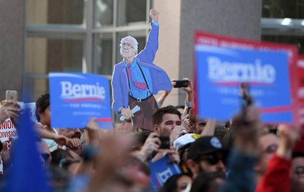 A cardboard cutout of Democratic presidential candidate Bernie Sanders is held up while he speaks to supporters during a rally for local union members in San Francisco, California on May 18, 2016. / AFP PHOTO / JOSH EDELSON