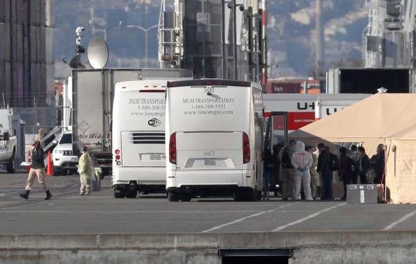 OAKLAND, CALIFORNIA - MARCH 10: Medical personnel prepare to screen passengers as they disembark from the Princess Cruises Grand Princess cruise ship in the Port of Oakland on March 10, 2020 in Oakland, California. Passengers are slowly disembarking from the Princess Cruises Grand Princess a day after it docked at the Port of Oakland. The ship was held off the coast of California after 21 people on board tested tested positive for COVID-19 also known as the Coronavirus. Justin Sullivan/Getty Images/AFP== FOR NEWSPAPERS, INTERNET, TELCOS & TELEVISION USE ONLY ==