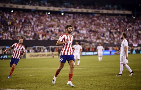 Atletico Madrid's forward Diego Costa celebrates his 2nd goal after scoring during the 2019 International Champions Cup football match between Real Madrid and Atletico Madrid at the Metlife Stadium Arena in East Rutherford, New Jersey on July 26, 2019. (Photo by Johannes EISELE / AFP)