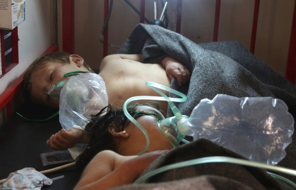 Syrian children receive treatment at a small hospital in the town of Maaret al-Noman following a suspected toxic gas attack in Khan Sheikhun, a nearby rebel-held town in Syrias northwestern Idlib province, on April 4, 2017.Warplanes carried out a suspected toxic gas attack that killed at least 35 people including several children, a monitoring group said. The Syrian Observatory for Human Rights said those killed in the town of Khan Sheikhun, in Idlib province, had died from the effects of the gas, adding that dozens more suffered respiratory problems and other symptoms. / AFP PHOTO / Mohamed al-Bakour / ADDING INFORMATION IN CAPTION