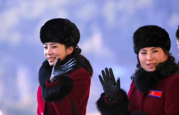 North Korean cheerleaders walk to their accomodation at the Inje Speedium, a racetrack and hotel complex, in Inje, north of Pyeongchang, on February 7, 2018 ahead of the Pyeongchang Winter Olympic Games.More than 200 young North Korean women arrived in South Korea to root for athletes from both sides of the peninsula at the Winter Olympics. / AFP PHOTO / JUNG Yeon-Je