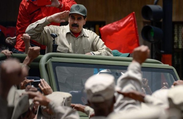 Handout picture released by the Venezuelan Presidency showing Venezuela's President Nicolas Maduro giving a televised message from Miraflores Presidential Palace in Caracas on March 21, 2021. (Photo by JHONN ZERPA / Venezuelan Presidency / AFP) / RESTRICTED TO EDITORIAL USE - MANDATORY CREDIT 'AFP PHOTO / VENEZUELA'S PRESIDENCY / JHONN ZERPA' - NO MARKETING - NO ADVERTISING CAMPAIGNS - DISTRIBUTED AS A SERVICE TO CLIENTS