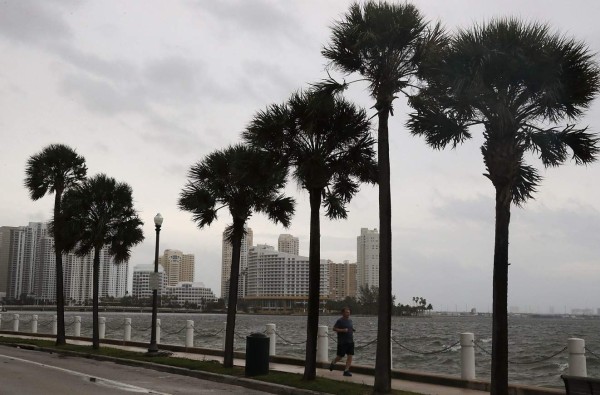 MIAMI, FL - SEPTEMBER 09: A jogger gets in a run as the outerbands of Hurricane Irma start to reach Florida on September 9, 2017 in Miami, Florida. Florida is in the path of the Hurricane which may come ashore at category 4. Joe Raedle/Getty Images/AFP== FOR NEWSPAPERS, INTERNET, TELCOS & TELEVISION USE ONLY ==