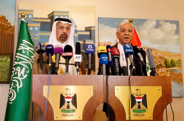 Saudi energy minister, Khalid al-Falih (L), holds a press conference with his Iraqi counterpart Jabbar al-Luaybi on May 22, 2017, in Baghdad.Iraq has agreed to a nine-month extension of a production cut pact among OPEC members that is aimed at boosting crude prices, the country's oil minister said. / AFP PHOTO / SABAH ARAR