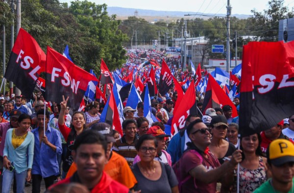 Supporters of Nicaraguan President Daniel Ortega take part in a demonstration called 'Love in times of COVID-19', in Managua on March 14, 2020. (Photo by INTI OCON / AFP)