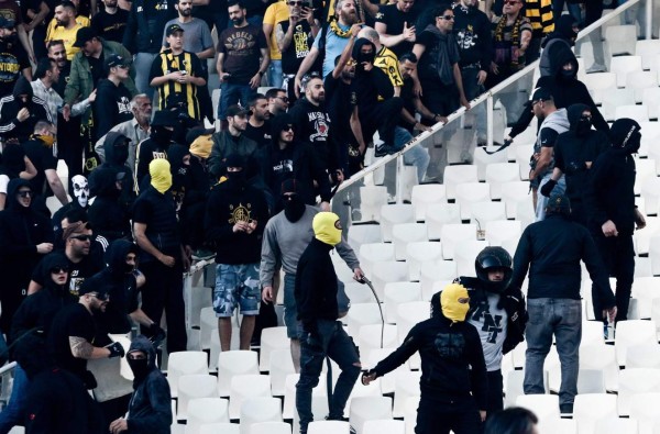 AEK FC fans gather in the stands ahead of the Greek Cup Final football match between AEK FC and PAOK Salonika at the Olympic stadium in Athens on May 12, 2018. / AFP PHOTO / ANDREAS PAPAKONSTANTINOU
