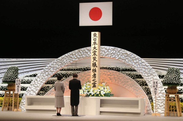 Japanese Prince Akishino (R), accompanied by Princess Kiko, delivers a speech in front of the altar for the victims of the March 11, 2011 earthquake and tsunami at the national memorial service in Tokyo on March 11, 2017. Japan paused to mark six years since a deadly earthquake, tsunami and nuclear disaster devastated its northeastern coast, as more than 100,000 people remain unable or unwilling to return home. / AFP PHOTO / POOL / Koji Sasahara
