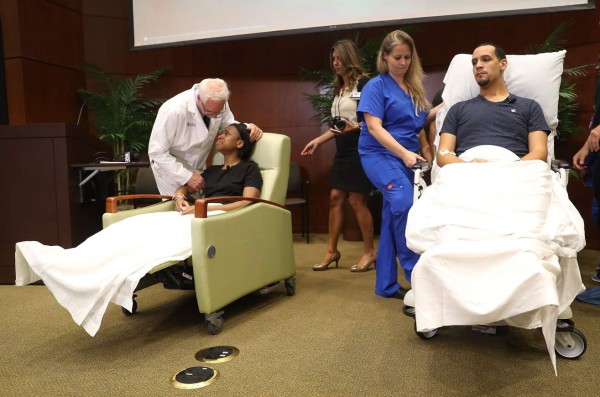 ORLANDO, FL - JUNE 14: Patience Carter (L) and Angel Santiago (R) prepare to leave after speaking to the media from the Florida Hospital about being shot in the Pulse gay nightclub terror attack on June 14, 2016 in Orlando, Florida. Omar Mateen killed 49 people and injured 53 others in what is the deadliest mass shooting in the country's history. Joe Raedle/Getty Images/AFP== FOR NEWSPAPERS, INTERNET, TELCOS & TELEVISION USE ONLY ==