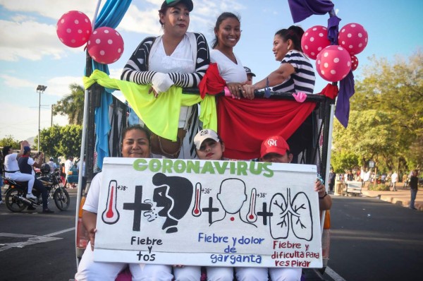 Supporters of Nicaraguan President Daniel Ortega take part in a demonstration called 'Love in times of COVID-19', in Managua on March 14, 2020. (Photo by INTI OCON / AFP)