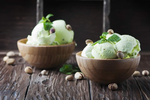 Pistachio icecream with mint and nuts, selective focus