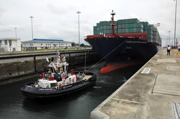 Chinese-chartered merchant ship Cosco Shipping Panama crosses the new Agua Clara Locks during the inauguration of the expansion of the Panama Canal in Colon, 80 km from Panama City on June 26, 2016 on June 26, 2016.A giant Chinese-chartered freighter nudged its way into the expanded Panama Canal on Sunday to mark the completion of nearly a decade of work forecast to boost global trade. / AFP PHOTO / EDUARDO GRIMALDO