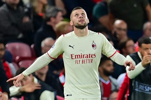 AC Milan's Croatia's forward Ante Rebic celebrates scoring his team's first goal during the UEFA Champions League 1st round Group B football match between Liverpool and AC Milan at Anfield in Liverpool, north west England on September 15, 2021. (Photo by Paul ELLIS / AFP)
