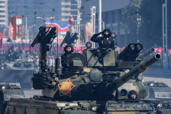 Korean People's Army (KPA) soldiers stand atop armoured vehicles during a military parade on Kim Il Sung square in Pyongyang on September 9, 2018.North Korea held a military parade to mark its 70th birthday, but refrained from showing off the intercontinental ballistic missiles that have seen it hit with multiple international sanctions. / AFP PHOTO / Ed JONES