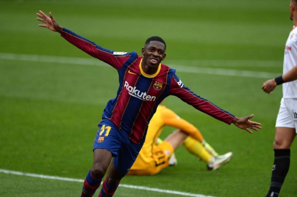 Barcelona's French forward Ousmane Dembele celebrates after scoring a goal during the Spanish league football match between Sevilla FC and FC Barcelona at the Ramon Sanchez Pizjuan stadium in Seville on February 27, 2021. (Photo by CRISTINA QUICLER / AFP)