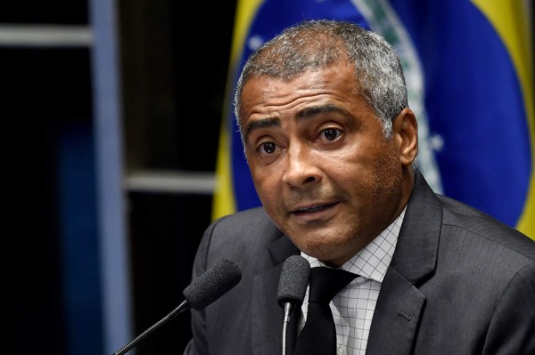 Senator and former soccer star Romario de Souza Faria, known as Romario delivers a speech during debate of a vote on suspending President Dilma Rousseff and launching an impeachment trial, in Brasilia on May 11, 2016. Brazil's Senate opened debate Wednesday ahead of a vote on suspending President Dilma Rousseff and launching an impeachment trial that could bring down the curtain on 13 years of leftist rule in Latin America's biggest country. Even allies of Rousseff, 68, said she had no chance of surviving the vote. / AFP PHOTO / EVARISTO SA