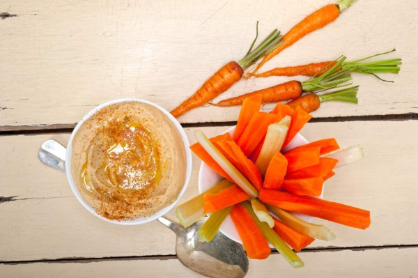 fresh hummus dip with raw carrot and celery arab middle eastent healthy food