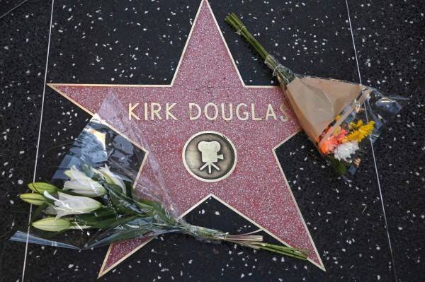 Flowers are placed on the star of late actor Kirk Douglas, February 5, 2020 on the Walk of Fame in Hollywood, California. - American cinema giant Kirk Douglas, who died on February 5 aged 103, rose to the heights of Hollywood from an impoverished childhood as the son of Jewish Russian immigrants. (Photo by Robyn Beck / AFP)