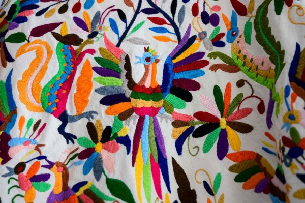 Detail of a piece by Mexican artisan Glafira Candelaria Jose, of the Otomi ethnic group, on display at her workshop in San Nicolas Village, in Tenango de Doria, Hidalgo state, Mexico, on June 18, 2019. - The Mexican government asked famous Venezuelan designer Carolina Herrera to explain her decision to use textile designs from three Mexican indigenous communities in six pieces of her Resort 2020 collection. (Photo by Pedro PARDO / AFP)