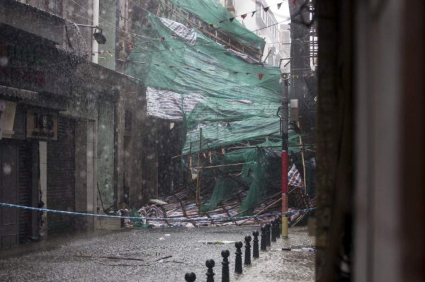 A concrete structure is battered by waves during Super Typhoon Mangkhut in Hong Kong on September 16, 2018. / AFP PHOTO / Anthony WALLACE