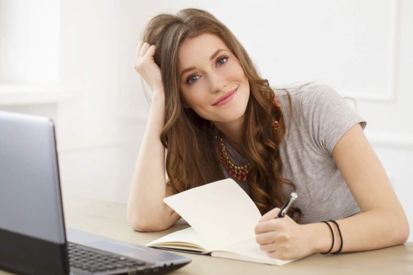 Student, office. Cute, beautiful woman by the table