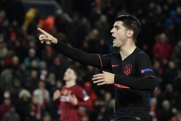 Atletico Madrid's Spanish striker Alvaro Morata celebrates scoring his team's third goal during the UEFA Champions league Round of 16 second leg football match between Liverpool and Atletico Madrid at Anfield in Liverpool, north west England on March 11, 2020. (Photo by JAVIER SORIANO / AFP)